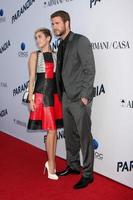 LOS ANGELES, AUG 8 - Miley Cyrus, Liam Hemsworth arrives at the Paranoia Los Angeles Premiere at the Directors Guild of America on August 8, 2013 in Los Angeles, CA photo