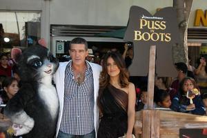 LOS ANGELES, OCT 23 - Antonio Banderas, Salma Hayek arriving at the Puss In Boots Premiere at the Regency Village Theater on October 23, 2011 in Westwood, CA photo