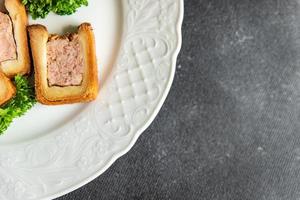 meat pate croute dough pork or beef, chicken french food fresh meal food snack on the table copy space food background rustic photo