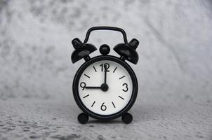 Alarm clock pointing at 9 o'clock with customizable space for ideas or text. Copy space photo