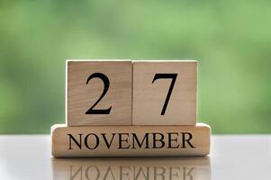 November 27 calendar date text on wooden blocks with copy space for ideas or text. Copy space photo