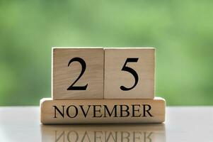 November 25 calendar date text on wooden blocks with copy space for ideas or text. Copy space photo
