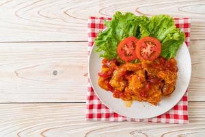 Fried fish topped with 3 flavors chili sauce photo