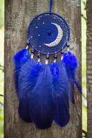 Handmade dream catcher with feathers threads and beads rope hanging photo