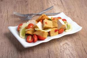 Fried tofu salad with fresh vegetables. Weight loss diet. photo