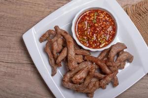 Sun-dried pork in a white plate photo