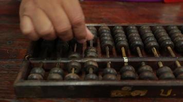 chinese abacus is a calculating tool used primarily in parts of Asia for performing arithmetic processes. The abacus was in use centuries before the adoption of the written modern numeral system. video