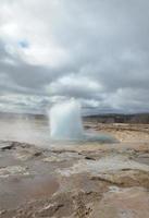 Strokur Geyser in Iceland Beginning to Erupt Steam photo