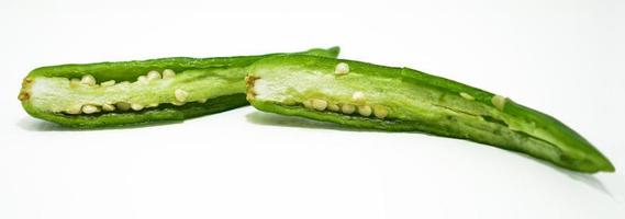 cayenne pepper cut half on white background photo