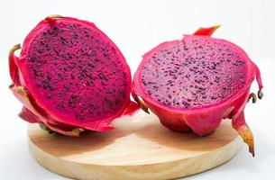 dragon fruit on wooden base photo