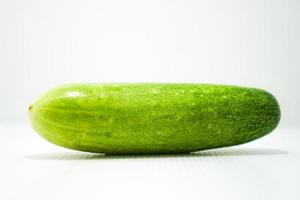 fresh healthy green cucumber on white background photo