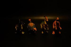 Dinosaurs toys on black background photo