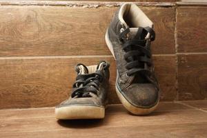 Old dirty kid shoes photo