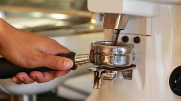 Close up coffee preparing in white ceramic cup from automatic coffee maker machine. video