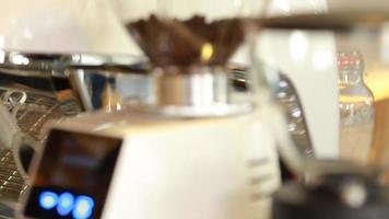 Close up coffee preparing in white ceramic cup from automatic coffee maker machine. video