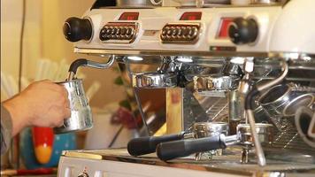 Close up coffee preparing in white ceramic cup from automatic coffee maker machine. video