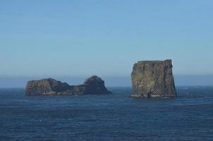 Huge boulders in the middle of the icelandic coast photo