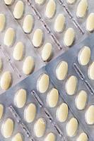 convex pills in a packaged photo