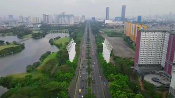 Jakarta-Indonesia, January 25, 2022 - Beautiful aerial view - buildings and traffic on the highway Benyyamin Sueb, North Jakarta. video