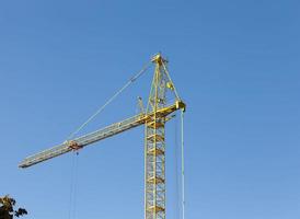 construction cranes with construction equipment photo