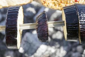 Cooking eggplant on fire photo