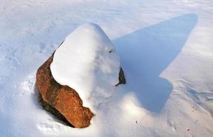 stone under snow photo