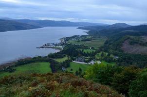 Breathtaking view of the Scottish highlands with lush green fields photo