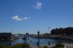 View of Boston Harbor with Boats Docked photo