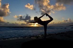 Silhouetted Yoga Dancer Pose At Sun Rise photo