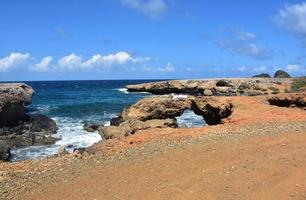 Natural Bridge by Black Stone Beach in Aruba photo