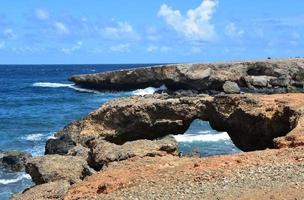 Views of Black Sand Beach on the Coast of Aruba photo