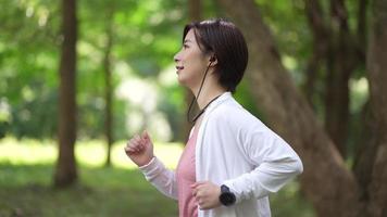 Woman jogging in the park video