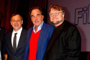 LAS VEGAS, APR 17 - Sam Raimi, Oliver Stone, Guillermo del Toro at the CinemaCon Filmmaker s Luncheon at the Caesars Palace on April 17, 2013 in Las Vegas, NV photo