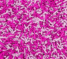 Sugar sprinkles Pink and white Sprinkles background 3d illustration photo