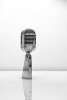 Microphone over white background photo