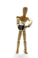 Wooden manikin holding dice photo