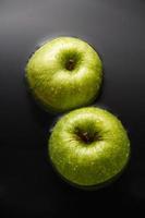 Two apples on water photo