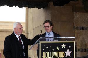 LOS ANGELES, MAR 16 - Malcolm McDowell, Gary Oldman at the Malcolm McDowell Walk of Fame Star Ceremony for The Muppets at the Hollywood Boulevard on March 16, 2012 in Los Angeles, CA photo