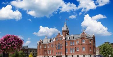 Red brick city hall with a clock tower in the scenic historic center in Stratford, Ontario photo