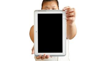 A smart white woman wearing a white dress showing a tablet on isolated or cut-out white background with a clipping path. photo