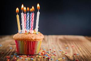 Cupcake with festive lighted candles photo