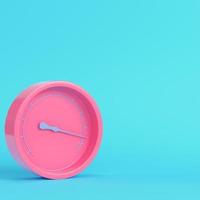 Pink gauge on bright blue background in pastel colors. Minimalism concept photo