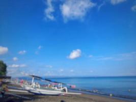 defocused abstract background of beach with clear blue sky on the island of Lombok, Indonesia photo