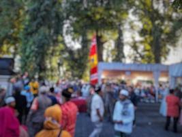 abstract blurred background of people attending ceremonial events photo