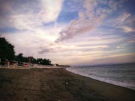 defocused abstract background of beach with clear blue sky on the island of Lombok, Indonesia photo