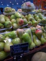 Defocused abstrack background of fresh fruits on display rack photo