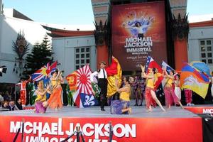 LOS ANGELES, JAN 26 - Cirque du Soleil Immortal Troupe perform at the Michael Jackson Immortalized Handprint and Footprint Ceremony at Graumans Chinese Theater on January 26, 2012 in Los Angeles, CA photo