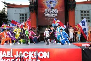 LOS ANGELES, JAN 26 - Cirque du Soleil Immortal Troupe perform at the Michael Jackson Immortalized Handprint and Footprint Ceremony at Graumans Chinese Theater on January 26, 2012 in Los Angeles, CA photo