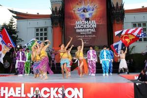 LOS ANGELES, JAN 26 - Cirque du Soleil Immortal Troupe perform at the Michael Jackson Immortalized Handprint and Footprint Ceremony at Graumans Chinese Theater on January 26, 2012 in Los Angeles, CA photo