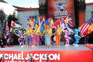 LOS ANGELES, JAN 26 - Cirque du Soleil Immortal Troupe perform at the Michael Jackson Immortalized Handprint and Footprint Ceremony at Graumans Chinese Theater on January 26, 2012 in Los Angeles, CA photo